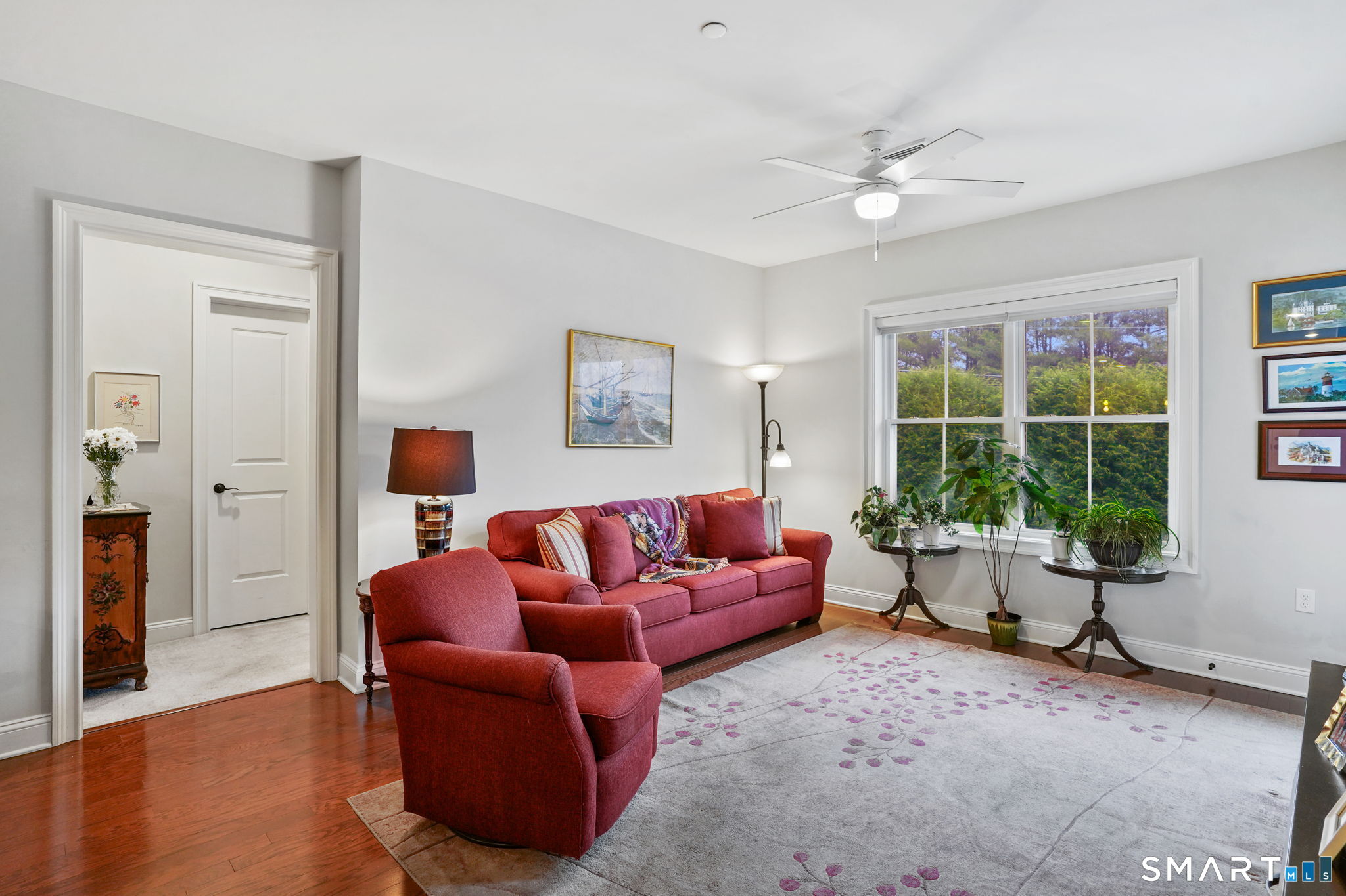 233 Danbury Road, Unit A209 Ridgefield, CT 06877 - Photo 10 of 25 a living room with furniture and a large window