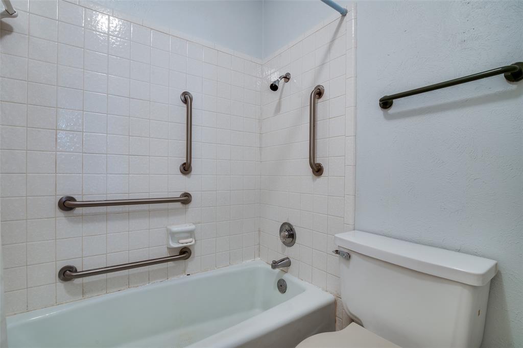1916 Cobblestone Lane Garland, TX 75042 - Photo 27 of 33 Bathroom featuring toilet and bathtub / shower combination