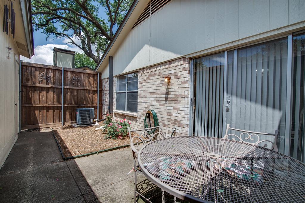 1916 Cobblestone Lane Garland, TX 75042 - Photo 31 of 33 View of patio featuring central air condition unit and outdoor dining space