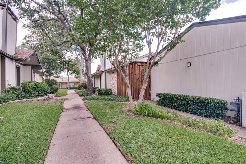 1916 Cobblestone Lane Garland, TX 75042 - Photo 5 of 33 Surrounding community with a yard