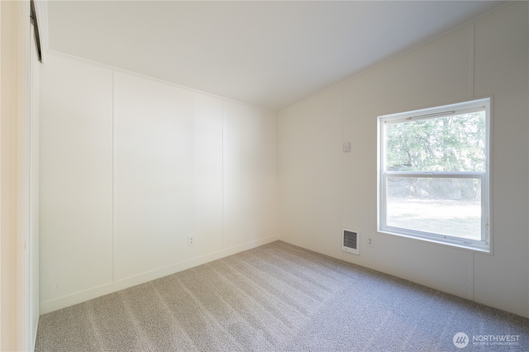 3408 Old Highway 99 North Road Burlington, WA 98233 - Photo 19 of 38 an empty room with a window