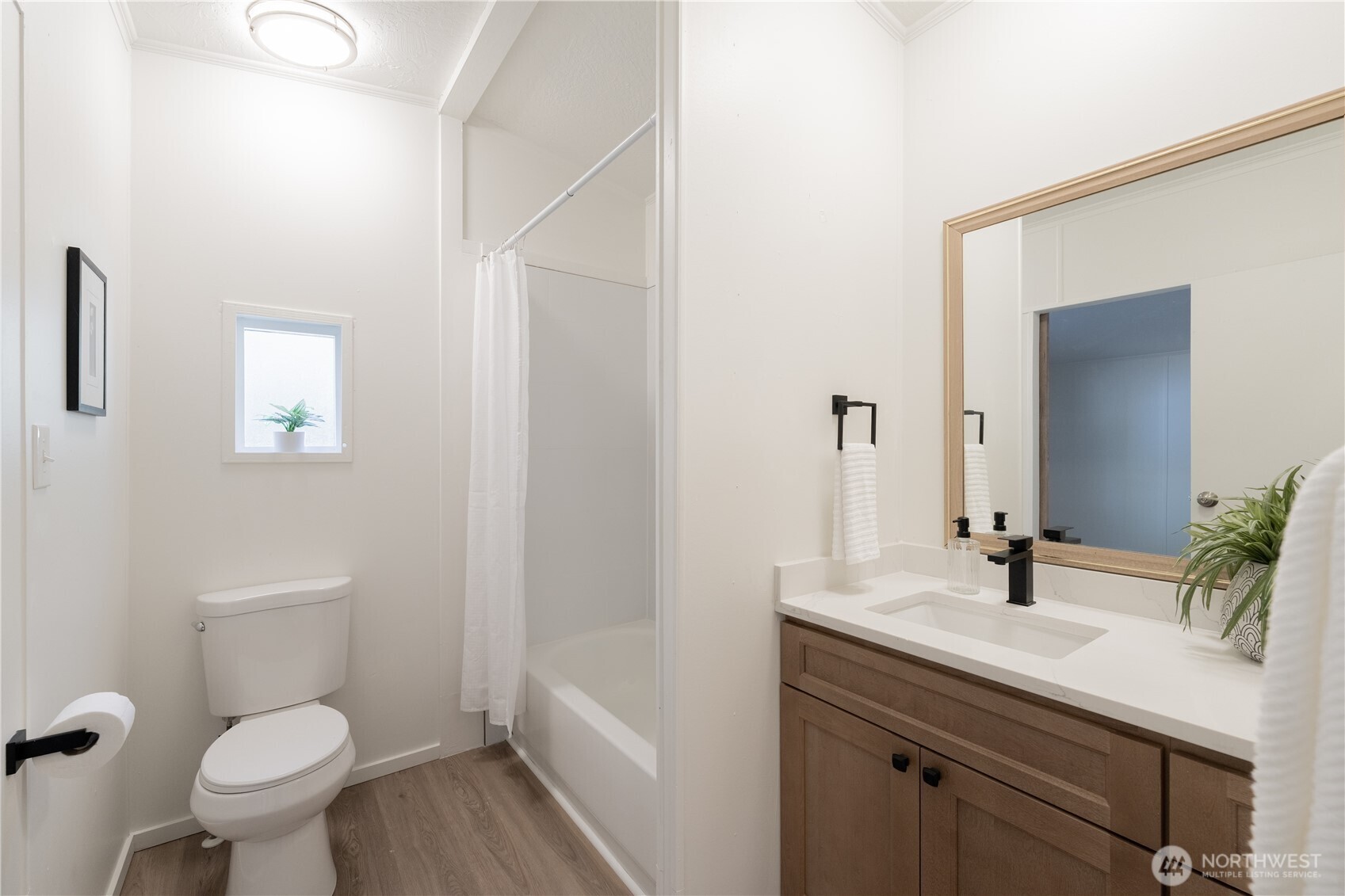 3408 Old Highway 99 North Road Burlington, WA 98233 - Photo 24 of 38 a bathroom with a sink toilet and vanity