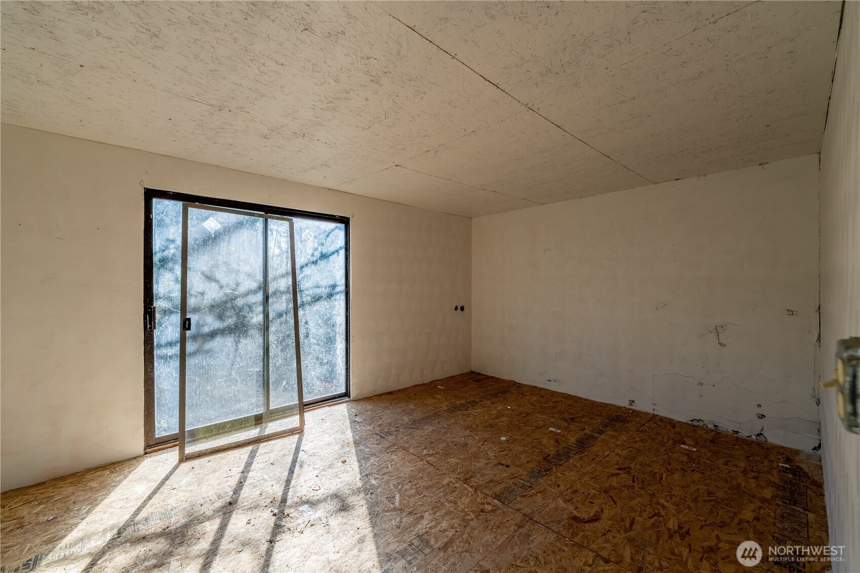 3408 Old Highway 99 North Road Burlington, WA 98233 - Photo 32 of 38 a view of an empty room with a window