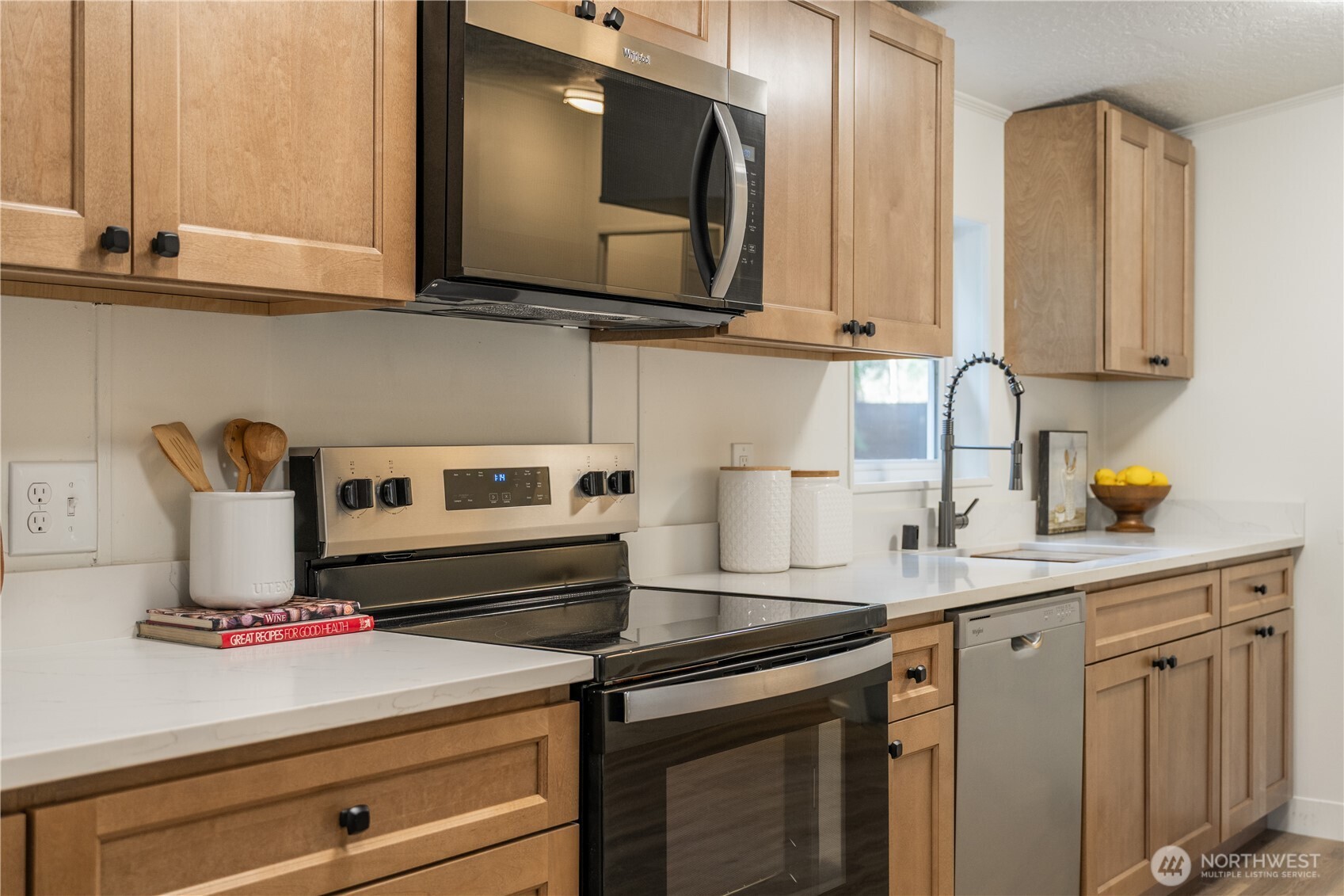3408 Old Highway 99 North Road Burlington, WA 98233 - Photo 10 of 38 a kitchen with a stove and a white cabinets