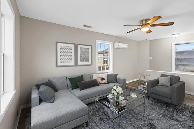 a living room with furniture and a window