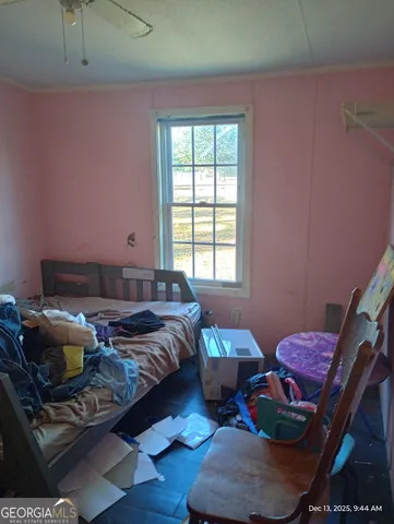 a bed room with two beds and a window