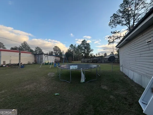 a view of a backyard with furniture
