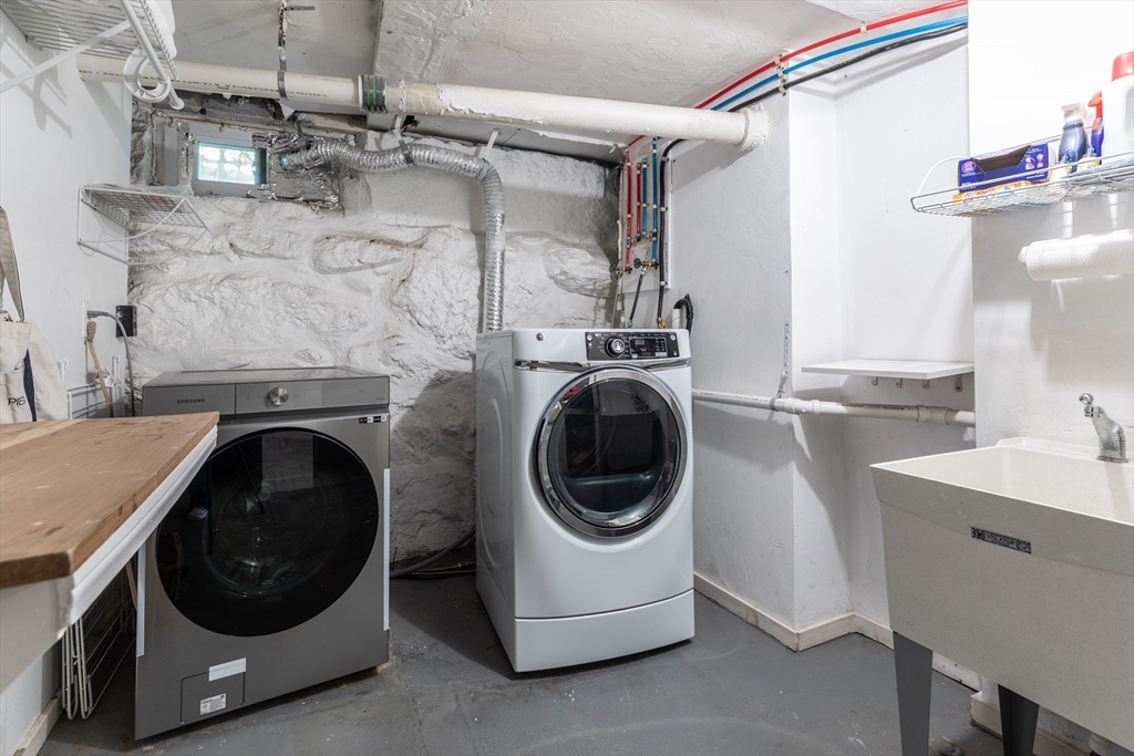 1076 Adams Street Boston, MA 02124 - Photo 24 of 29 a utility room with a washer and dryer