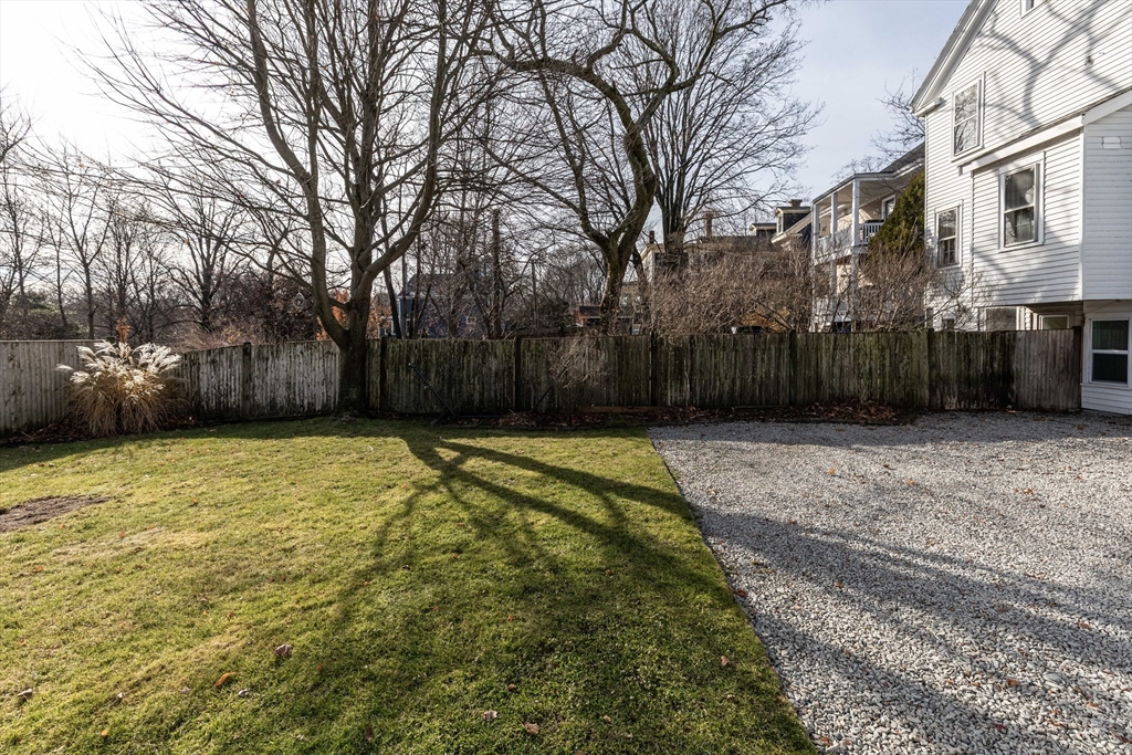 1076 Adams Street Boston, MA 02124 - Photo 27 of 29 a swimming pool with outdoor seating and yard