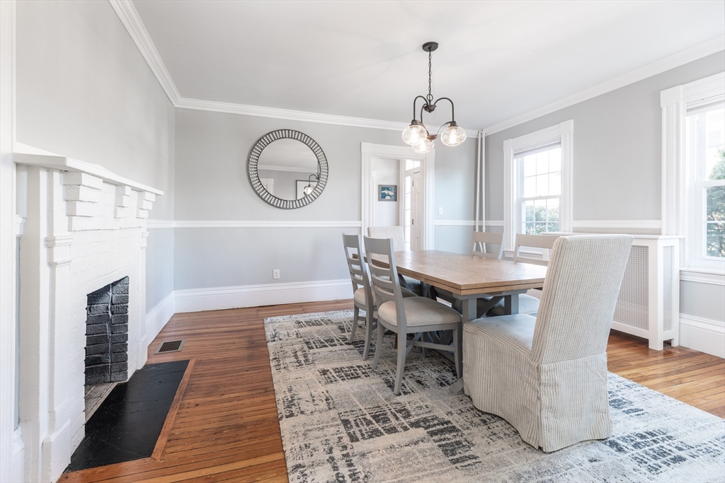 1076 Adams Street Boston, MA 02124 - Photo 8 of 29 a view of a dining room with furniture window and wooden floor