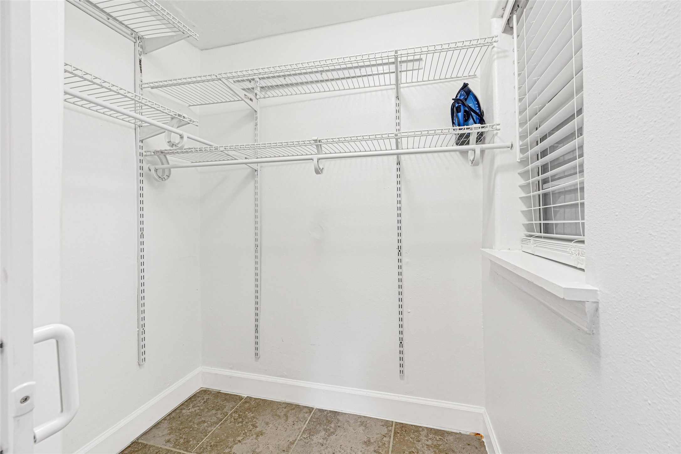 2809 Tooke Street Houston, TX 77023 - Photo 41 of 50 a view of walk in closet with empty racks