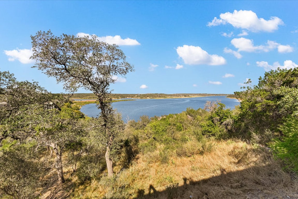 501 Coventry Road Spicewood, TX 78669 - Photo 20 of 24 a view of a lake with houses in the background