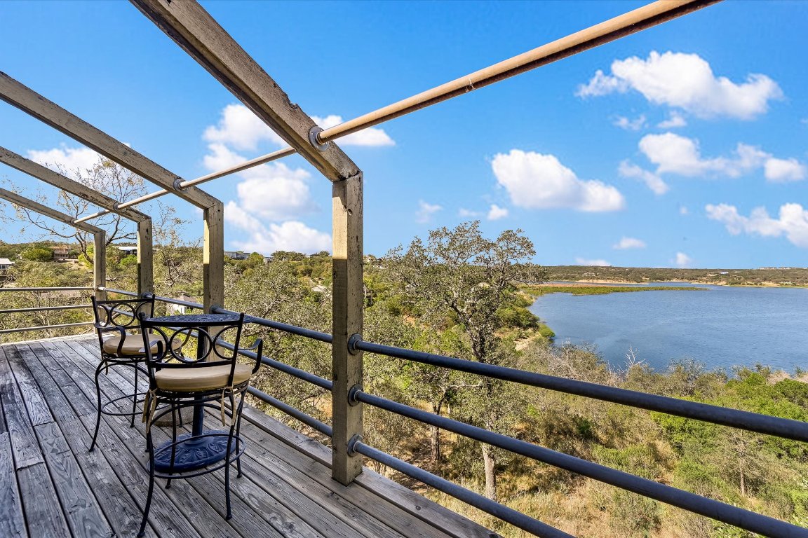 501 Coventry Road Spicewood, TX 78669 - Photo 21 of 24 a view of a balcony with chairs