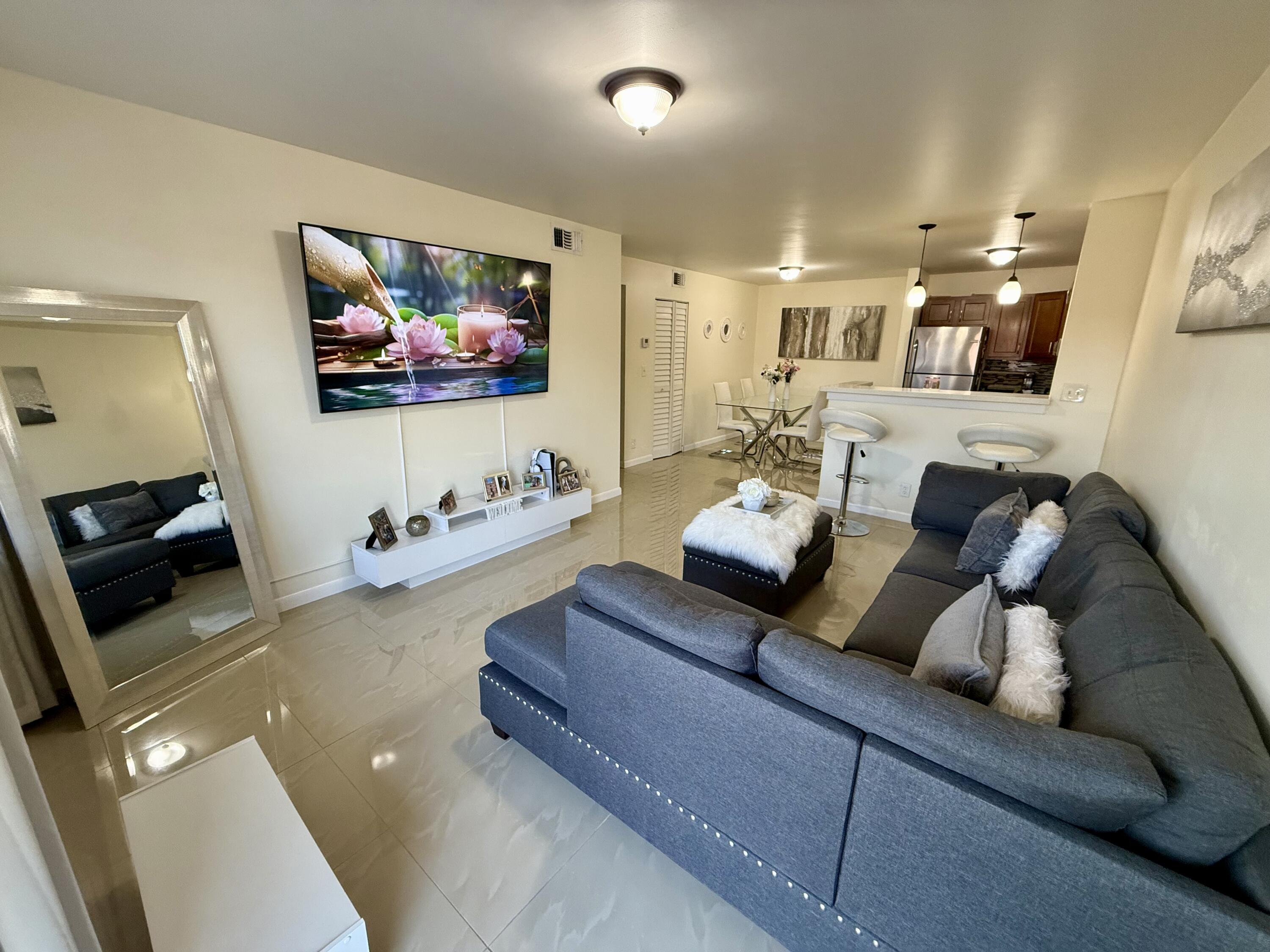 3280 Northwest 104th Avenue, Unit 3280 Coral Springs, FL 33065 - Photo 1 of 11 Living Room/ Entry Way