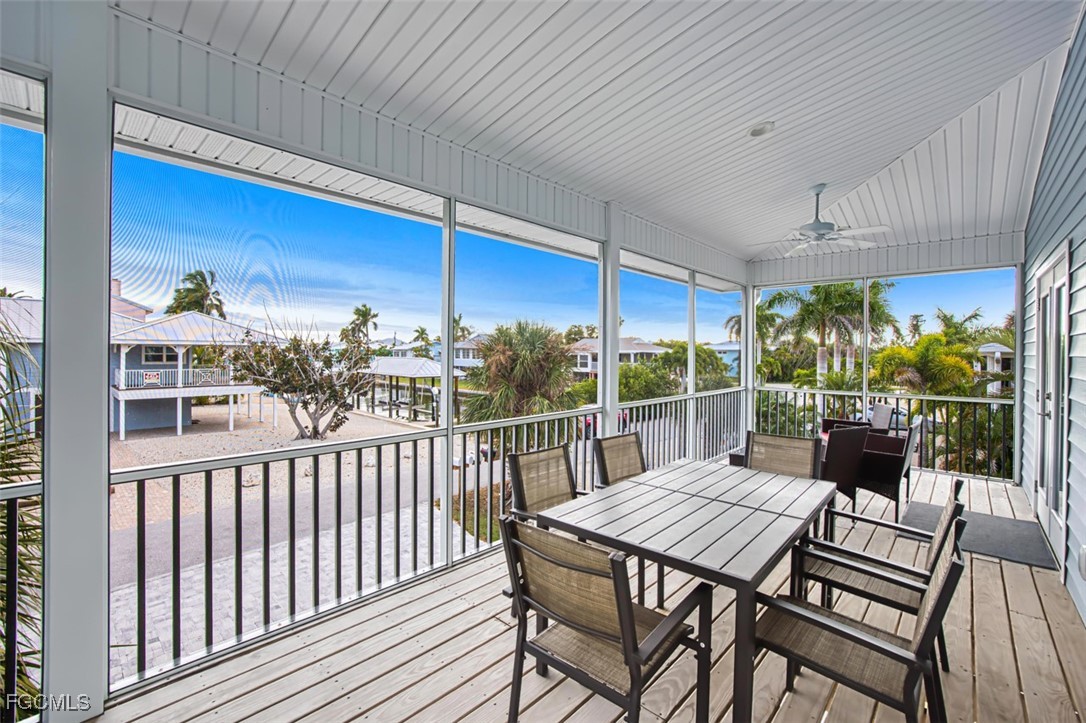 431 Lazy Way Fort Myers Beach, FL 33931 - Photo 11 of 40 a view of a patio with a table chairs and a patio