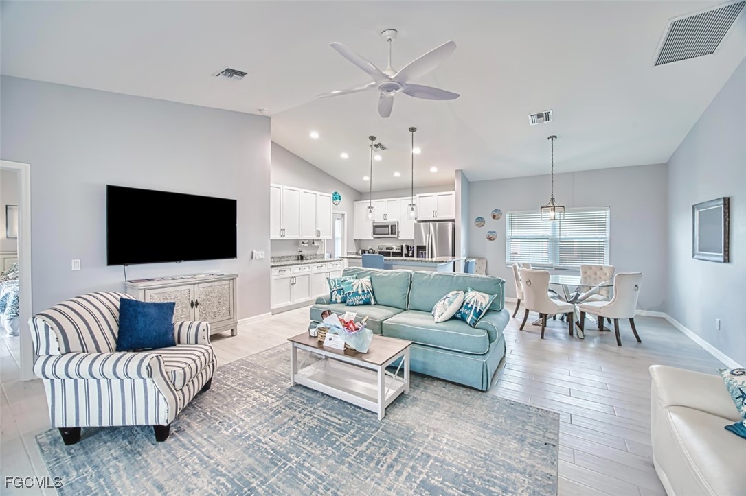 431 Lazy Way Fort Myers Beach, FL 33931 - Photo 13 of 40 a living room with furniture and a flat screen tv