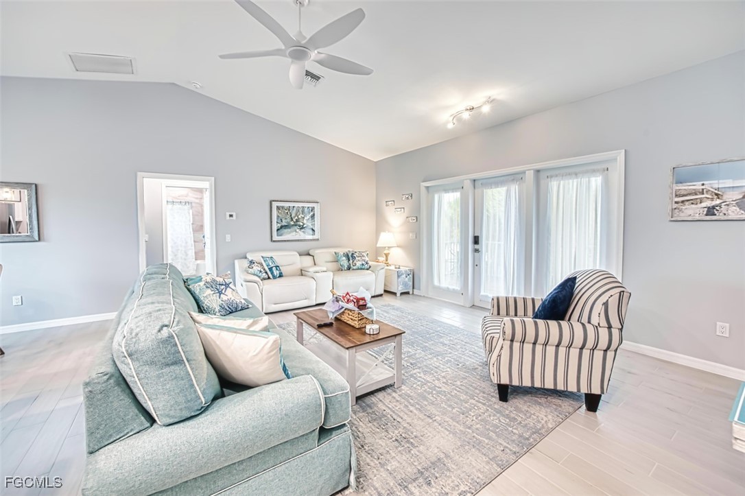 431 Lazy Way Fort Myers Beach, FL 33931 - Photo 20 of 40 a living room with furniture and a couch