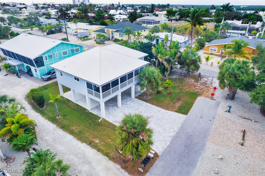 431 Lazy Way Fort Myers Beach, FL 33931 - Photo 2 of 40 an aerial view of a house with a garden and plants