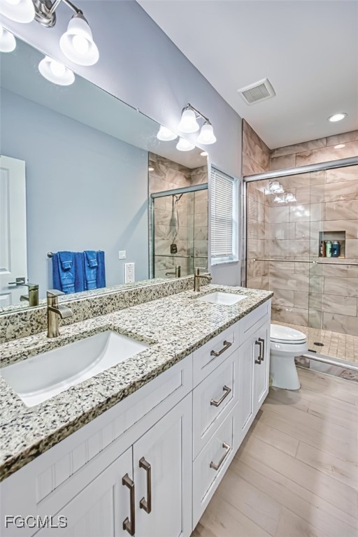 431 Lazy Way Fort Myers Beach, FL 33931 - Photo 27 of 40 a bathroom with a granite countertop sink mirror and toilet