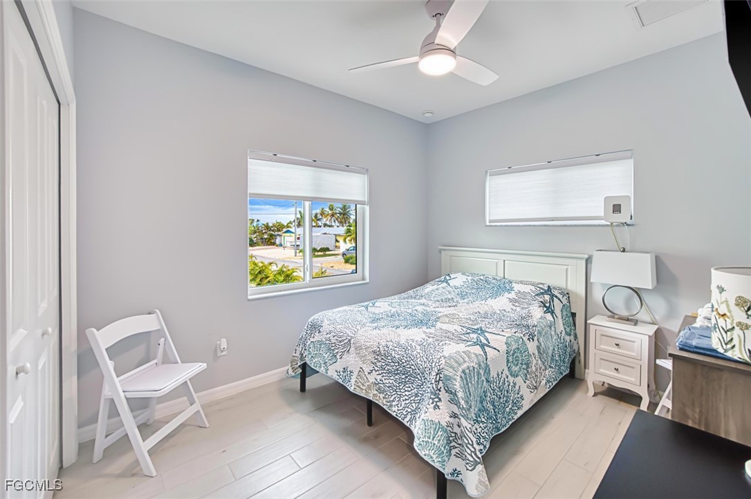 431 Lazy Way Fort Myers Beach, FL 33931 - Photo 35 of 40 a bedroom with a bed and a window