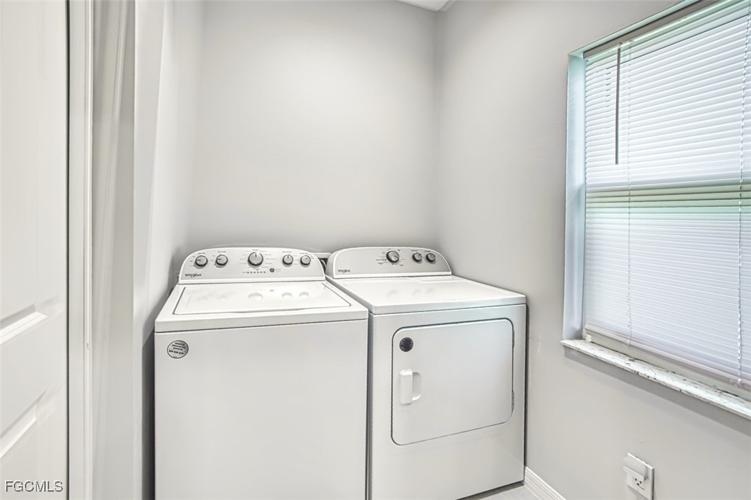 431 Lazy Way Fort Myers Beach, FL 33931 - Photo 37 of 40 a utility room with dryer and washer