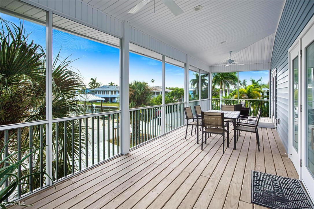 431 Lazy Way Fort Myers Beach, FL 33931 - Photo 9 of 40 a view of a chairs and table in patio with potted plants
