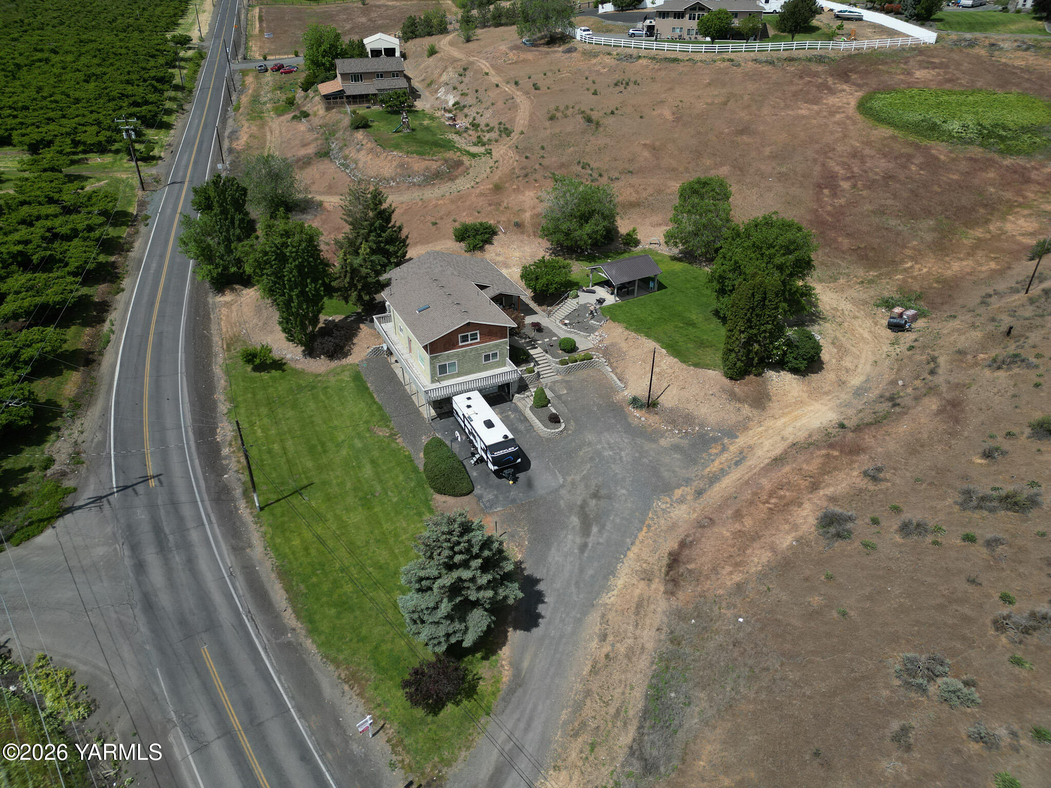 2121 Pleasant Hill Road Selah, WA 98942 - Photo 37 of 38 an aerial view of a house with a yard and outdoor seating