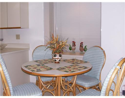 7727 La Mirada Drive, Unit 118 Boca Raton, FL 33433 - Photo 6 of 16 a table with chairs and a table in it