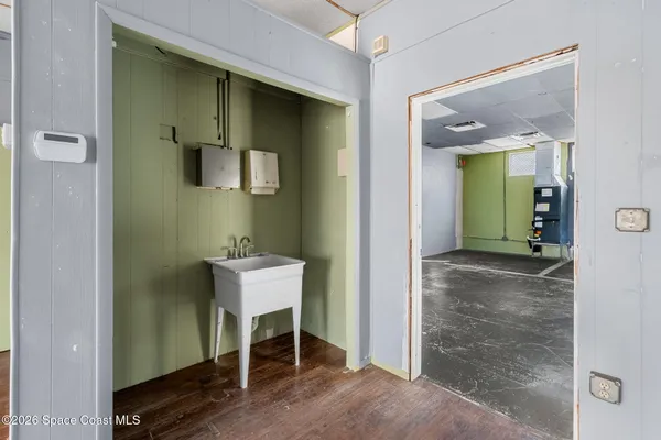 a bathroom with a toilet and a mirror