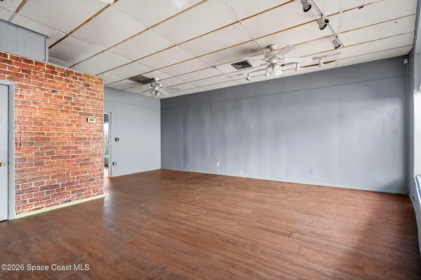 a view of an empty room with a window