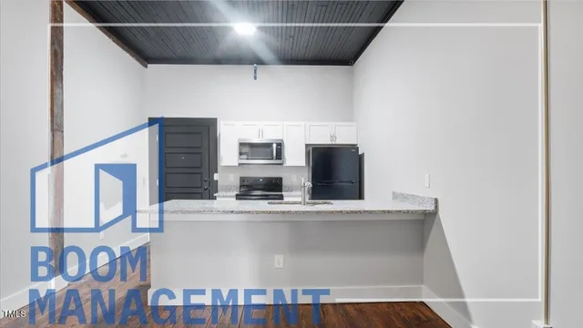 a view of counter top space with stainless steel appliances cabinets