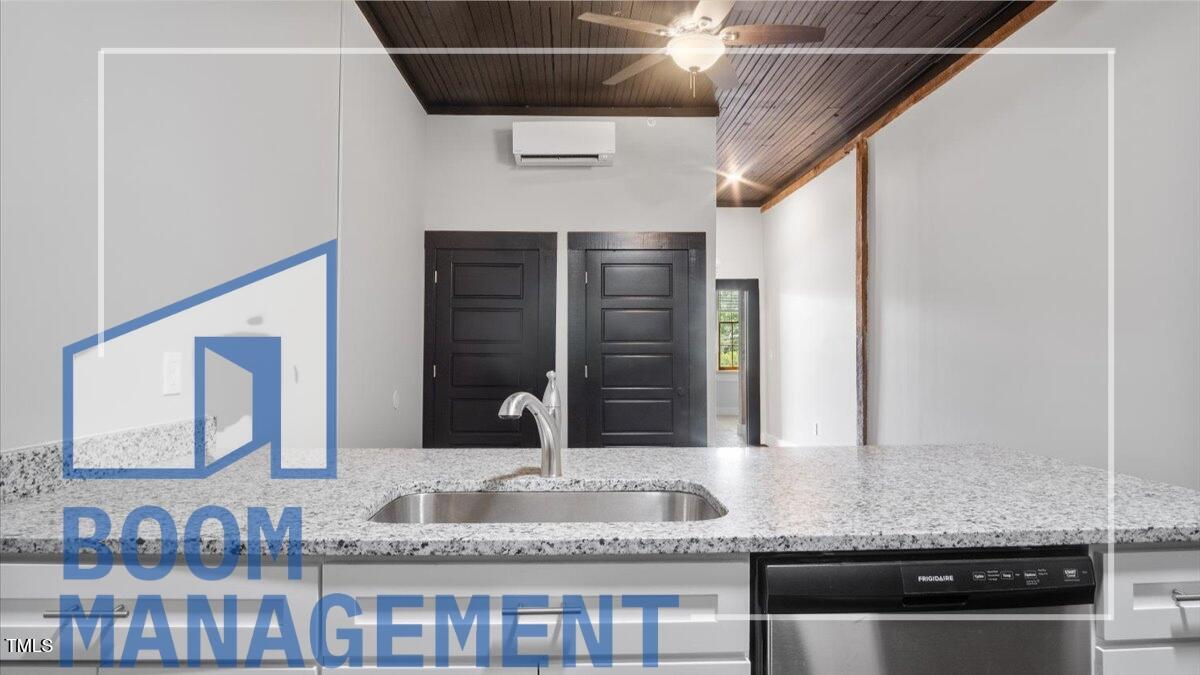 202 South Main Street, Unit 1BR 1 Bath, NC 27808 - Photo 17 of 31 a bathroom with a granite countertop sink and a mirror