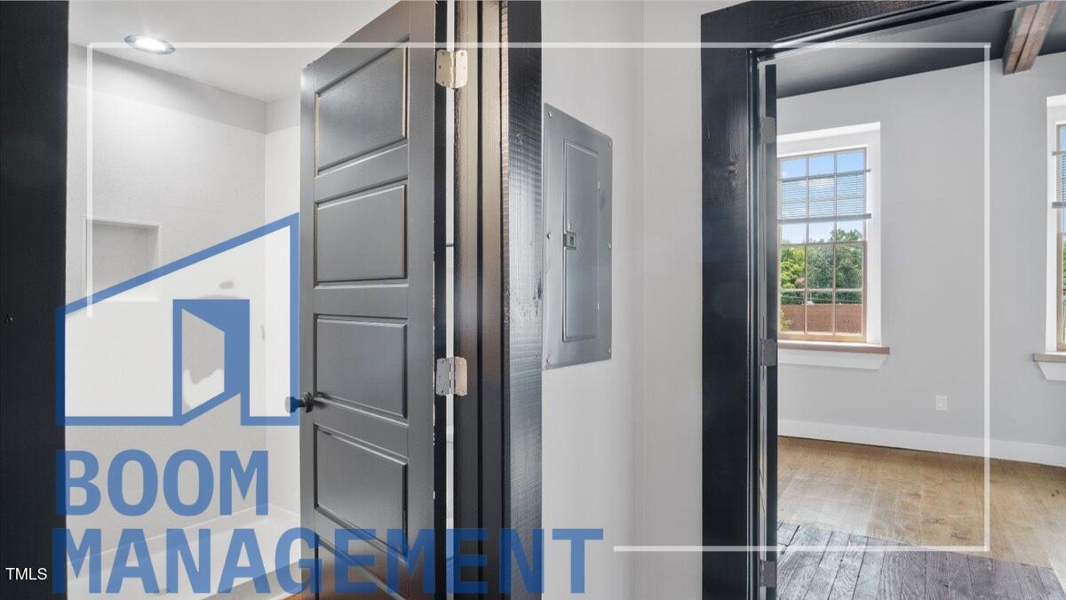 202 South Main Street, Unit 1BR 1 Bath, NC 27808 - Photo 20 of 31 a bathroom with a glass door shower and sink