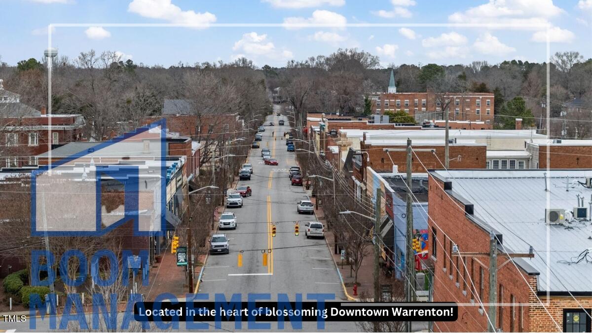 202 South Main Street, Unit 1BR 1 Bath, NC 27808 - Photo 2 of 31 a view of a city with tall buildings