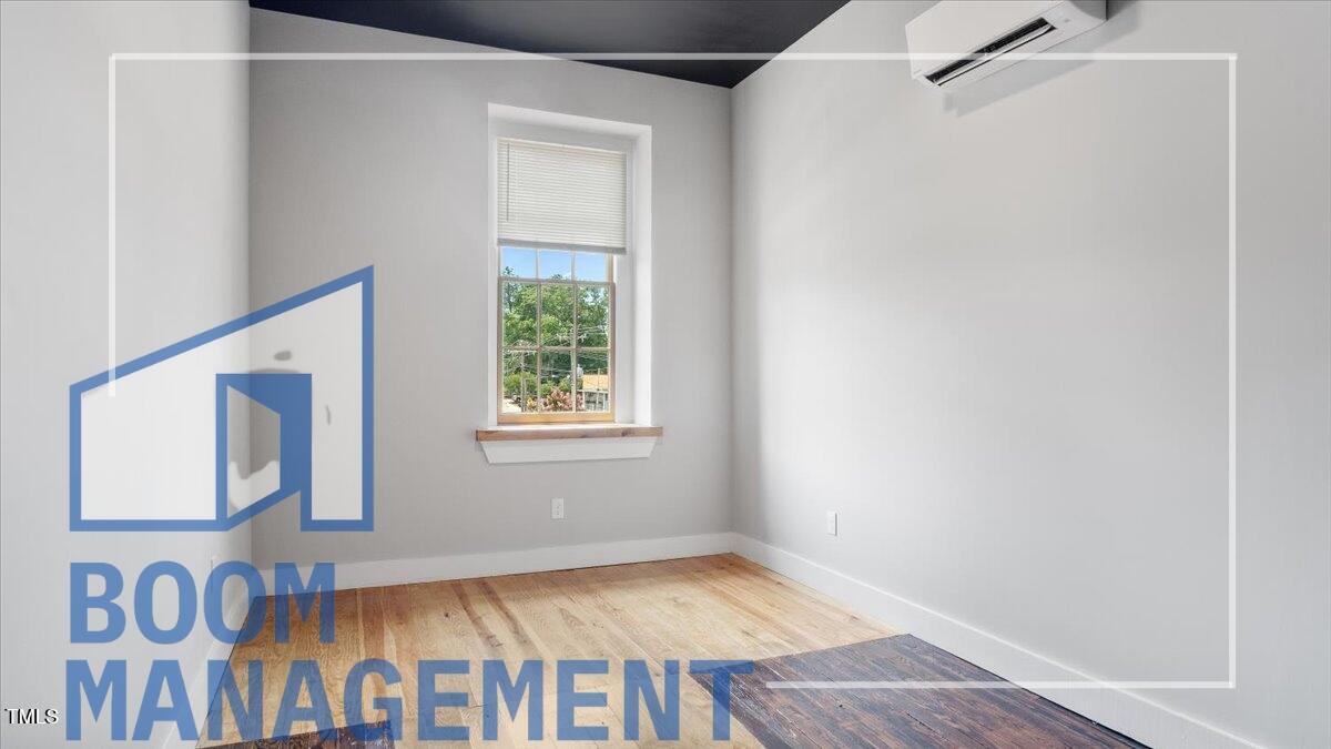 202 South Main Street, Unit 1BR 1 Bath, NC 27808 - Photo 23 of 31 a view of an empty room with a window
