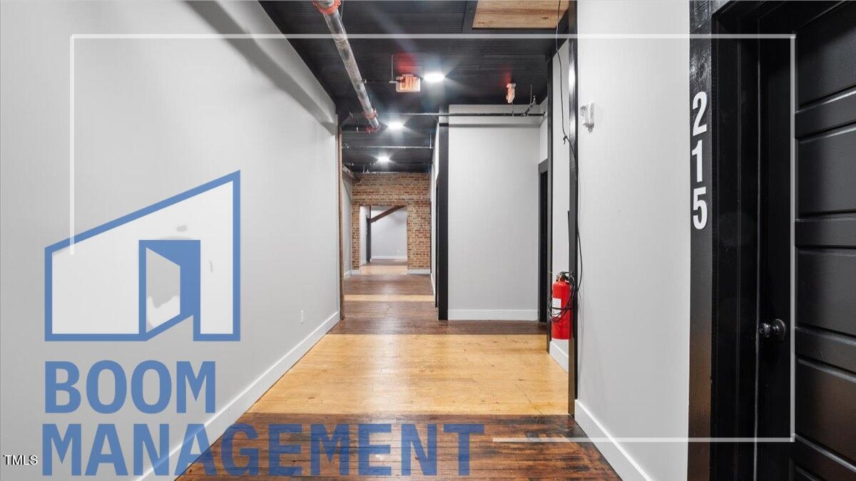 202 South Main Street, Unit 1BR 1 Bath, NC 27808 - Photo 30 of 31 a view of entryway and hall with wooden floor