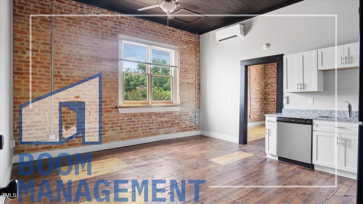 202 South Main Street, Unit 1BR 1 Bath, NC 27808 - Photo 5 of 31 a view of an empty room with a window