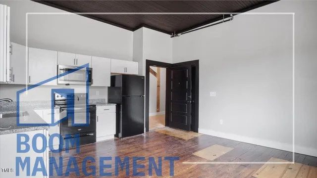 a kitchen with stainless steel appliances kitchen island a refrigerator and a stove