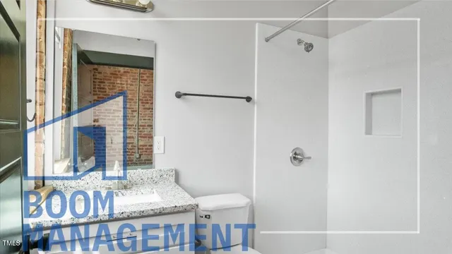 a bathroom with a tub and shower