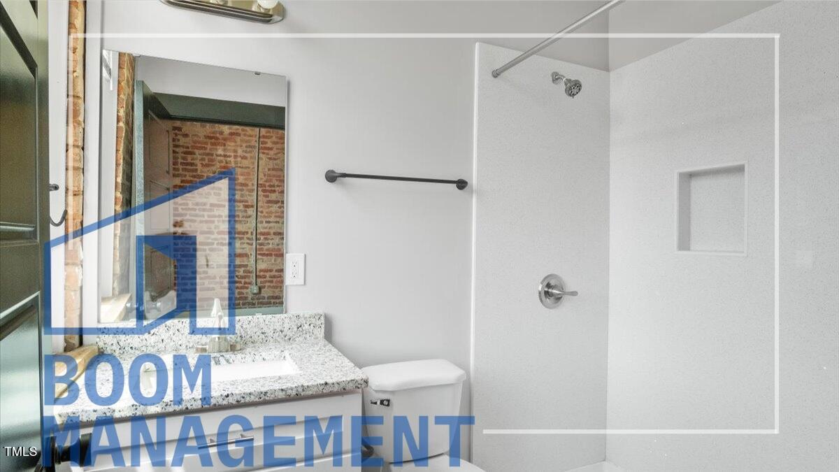 202 South Main Street, Unit 1BR 1 Bath, NC 27808 - Photo 8 of 31 a bathroom with a tub and shower