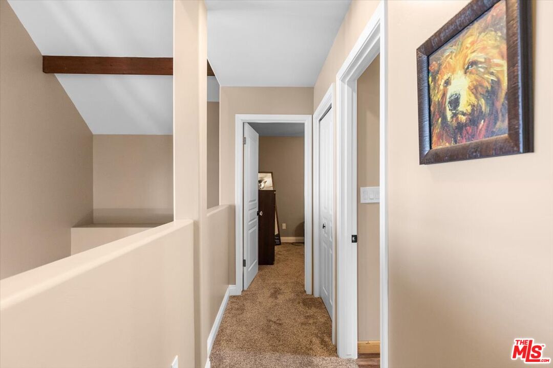 28081 Deertrail Drive Tehachapi, CA 93561 - Photo 19 of 31 a view of a hallway with wooden floor and door