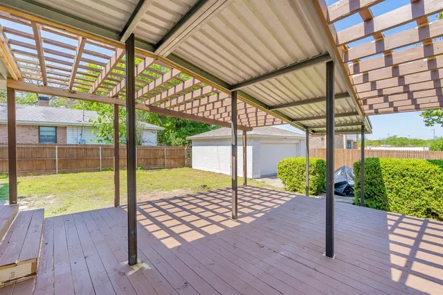 a porch with seating space and hardwood floor