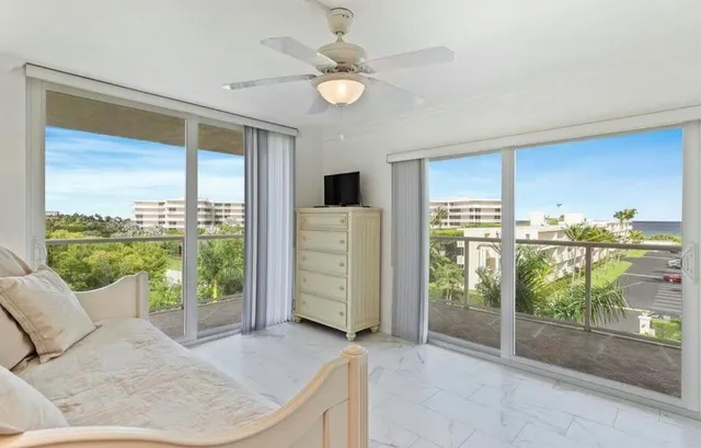 a living room with hardwood floor and sliding door