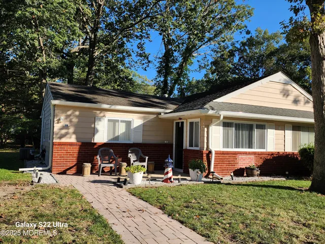a front view of a house with patio