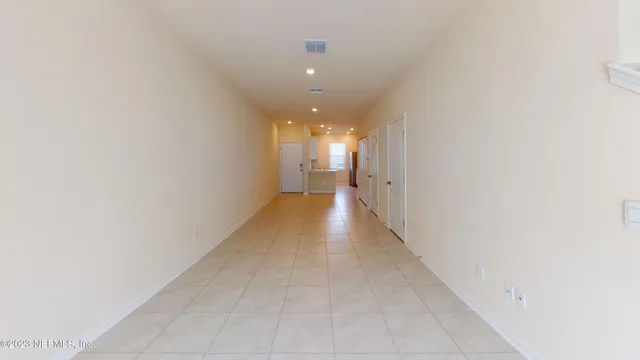 a view of a hallway with a window