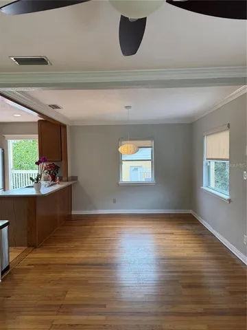a view of kitchen and wooden floor