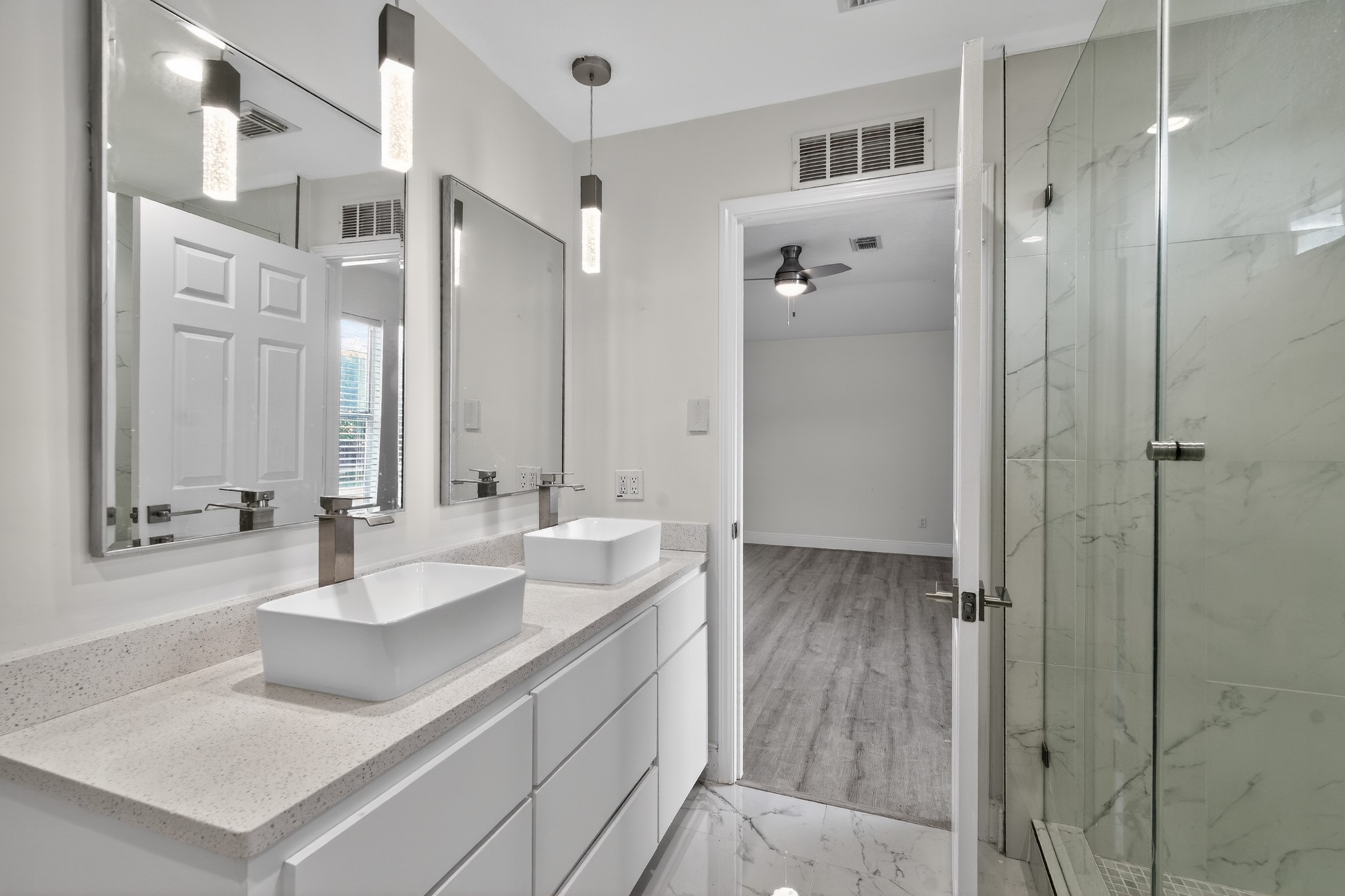 918 Ivycroft Lane Spring, TX 77373 - Photo 23 of 33 a bathroom with a double vanity sink and mirror