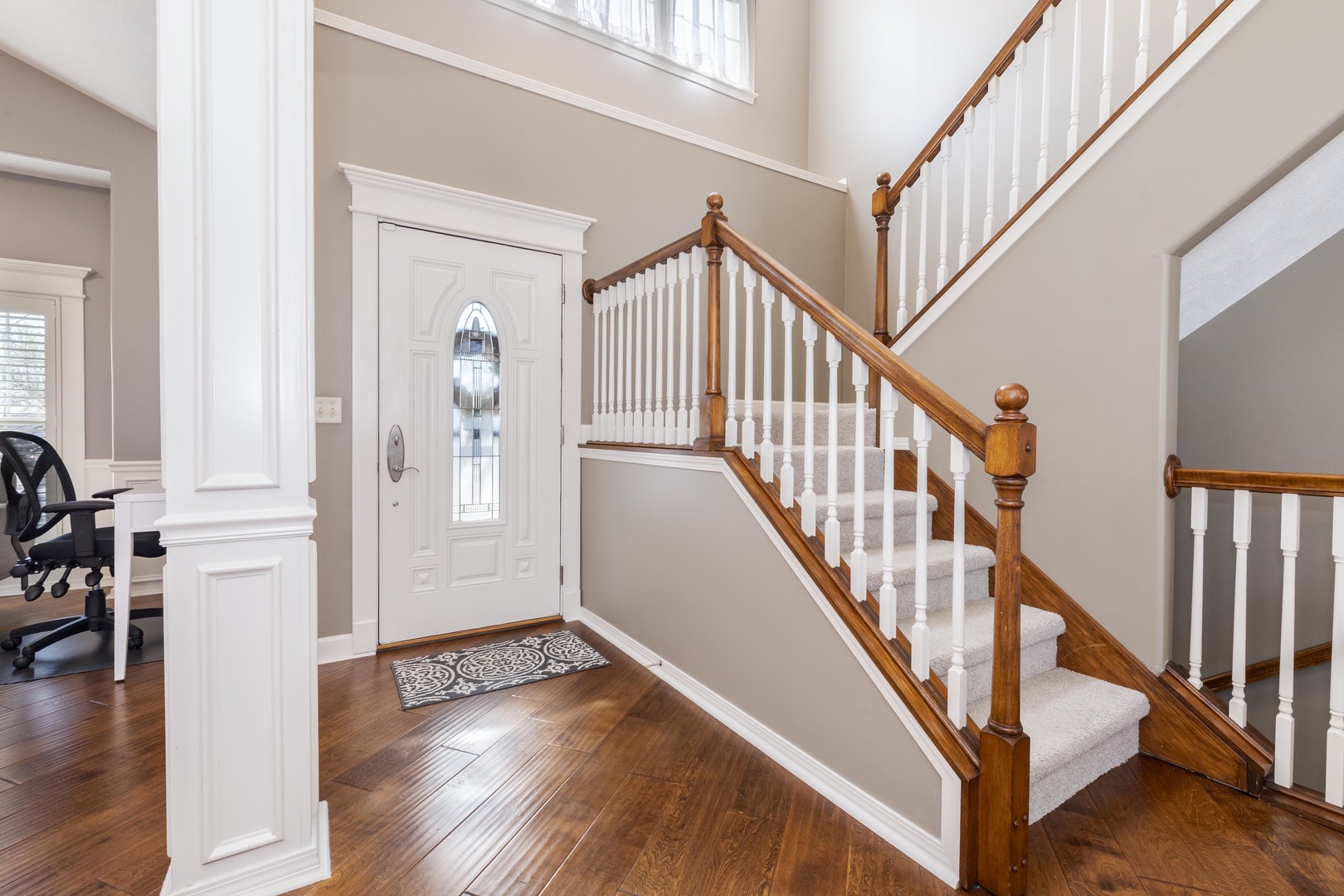1223 Joy Walk Way Normal, IL 61761 - Photo 17 of 48 a view of entryway with wooden floor and stairs
