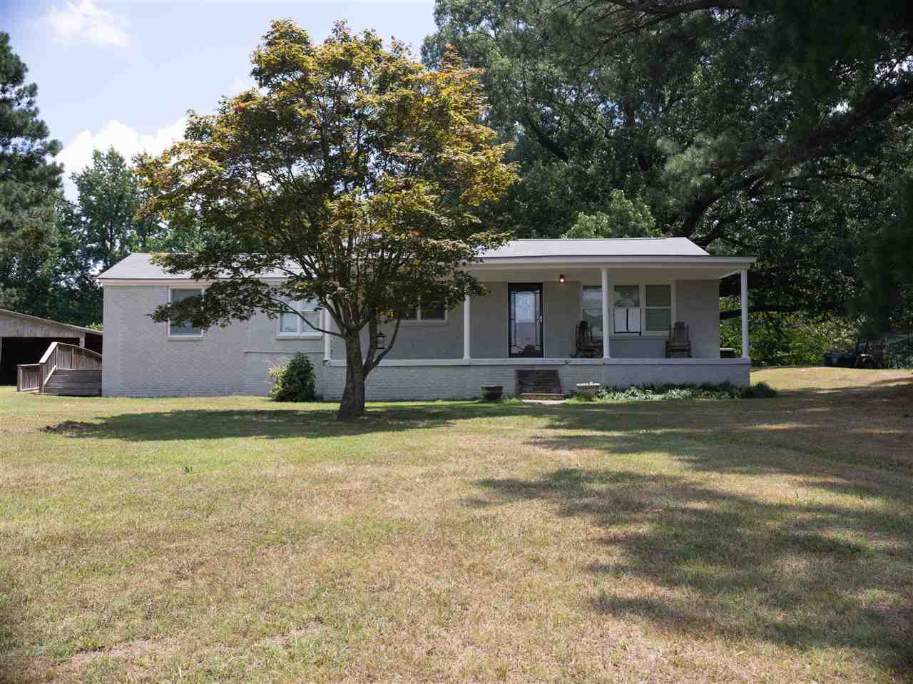 8916 Deadfall Road Millington, TN 38053 - Photo 1 of 13 Friendly Front Porch to sit and rock your cares away. Extra Parcel along side of Main Parcel that home is one is included in price bringing property over an acrea. Come inside and find renovations thruout.