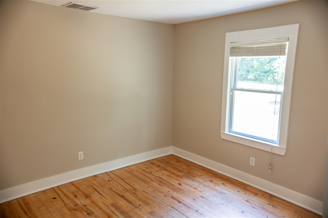 8916 Deadfall Road Millington, TN 38053 - Photo 7 of 13 Fresh paint in both Bedrooms and Hallway. Lovely Hardwood going into hallway also.